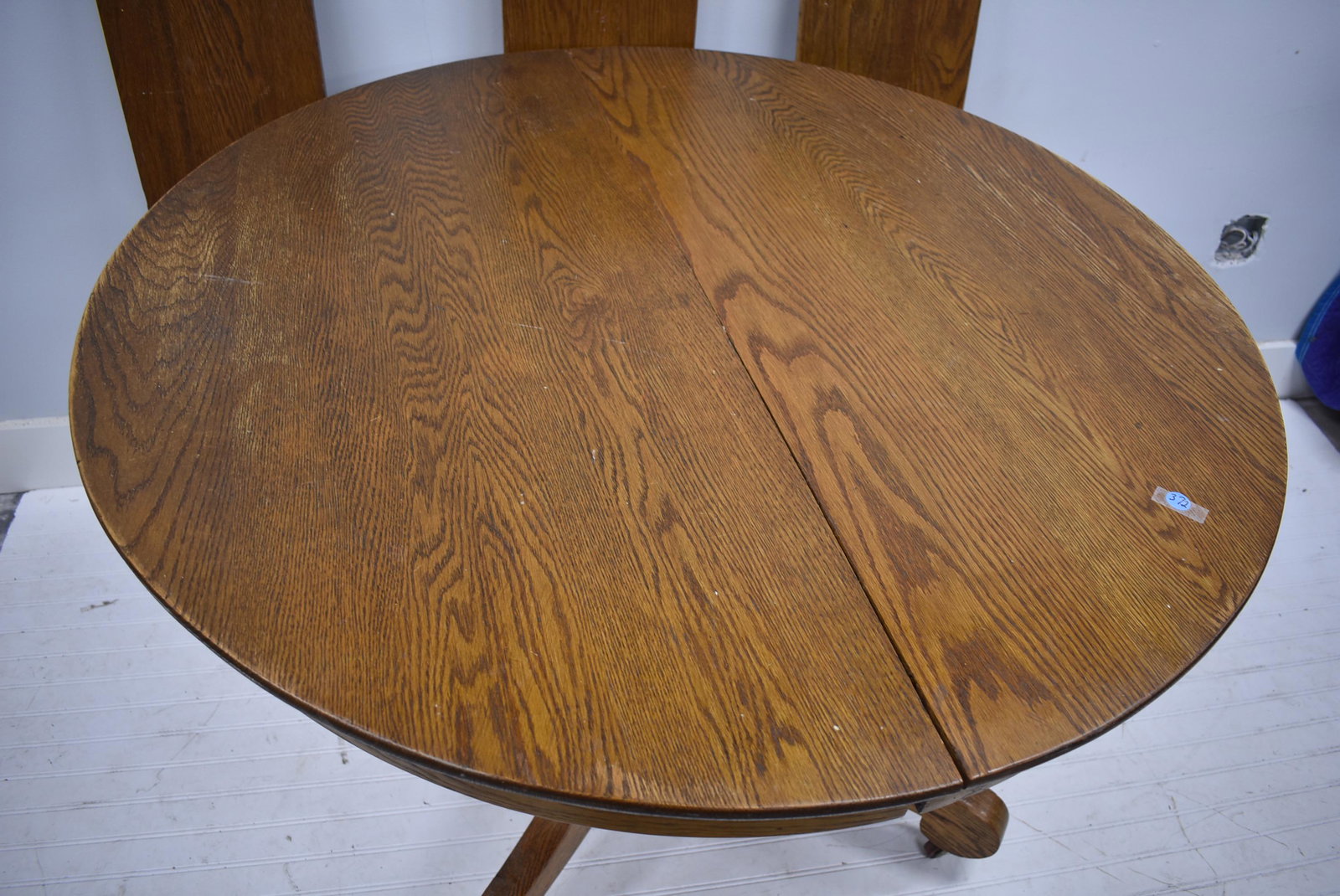 Round Oak Dining Table: Item measures approximately 29"H x 42" diameter. Item has three 10"W center boards.