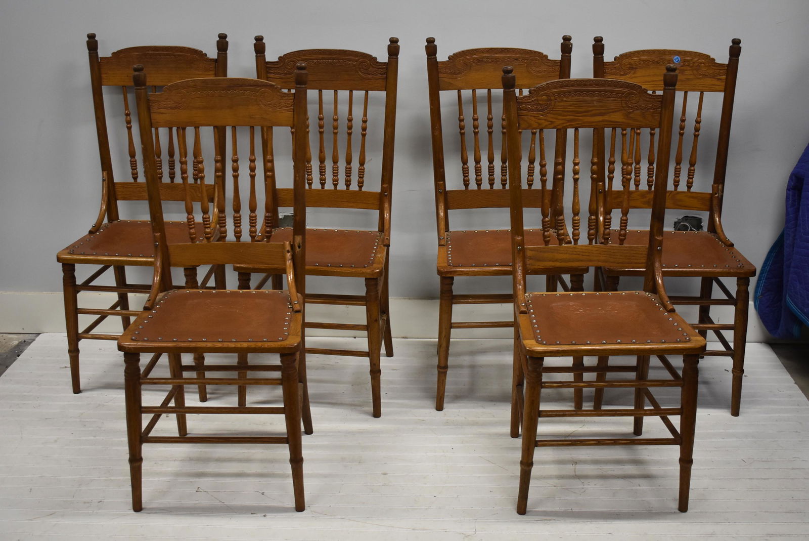 Set of Vintage Pressed Back Oak Chairs: Lot includes a set of 6 pressed back oak chairs with leather seats, and a child's pressed back rocker .