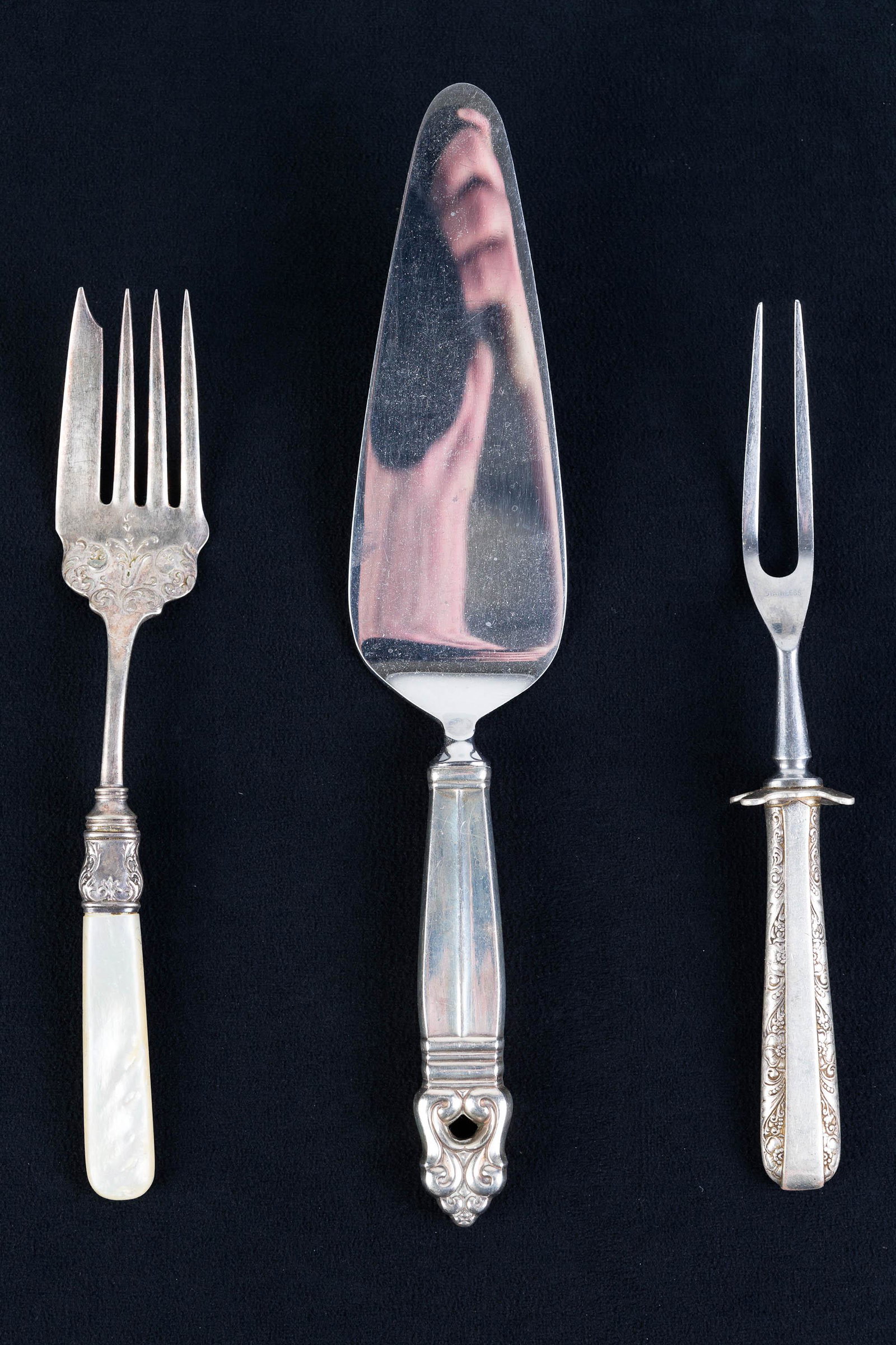 Sterling Handle Serving Pieces: Lot includes sterling handled cake server (10"L), sterling handled meat fork, and a serving fork with mother of pearl handle and sterling mount.