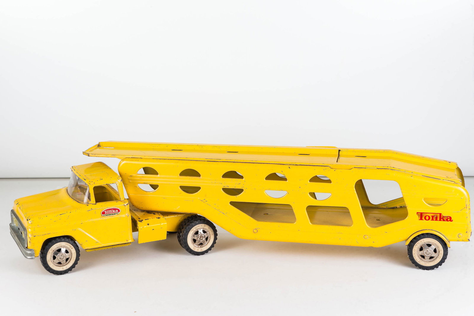 Vintage Tonka Car Carrier: Item measures approximately 27.5"L. Functional lift, grill and bumpers are intact. Has age appropriate wear.