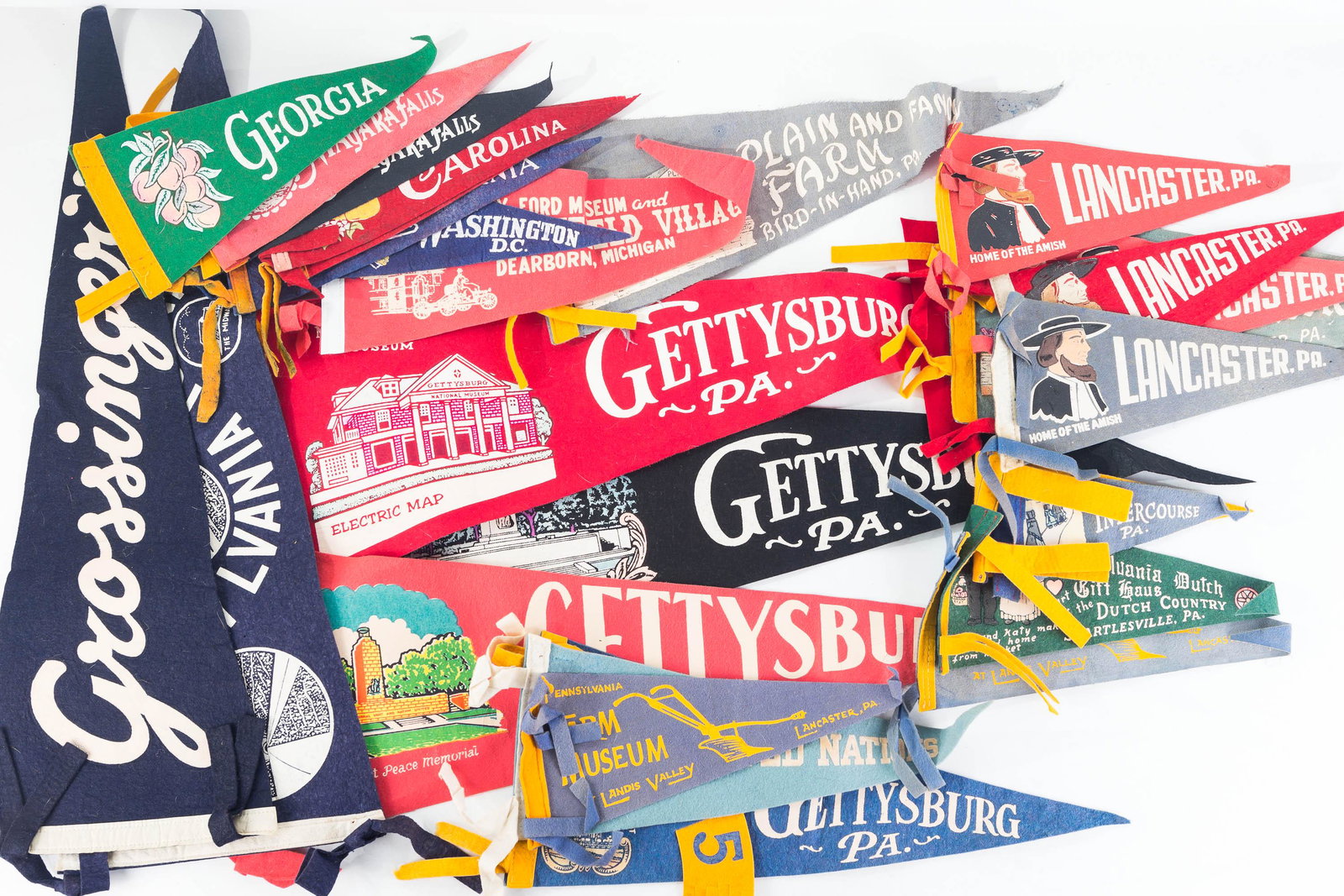 Vintage Travel Pennants: Lot includes 4 larger pennants (26"L), including PA Turnpike, Gettysburg PA, and others, and 21 smaller pennants including Indian Steps, PA Farm Museum, United Nations, Gettysburg 1955, Lancaster penn
