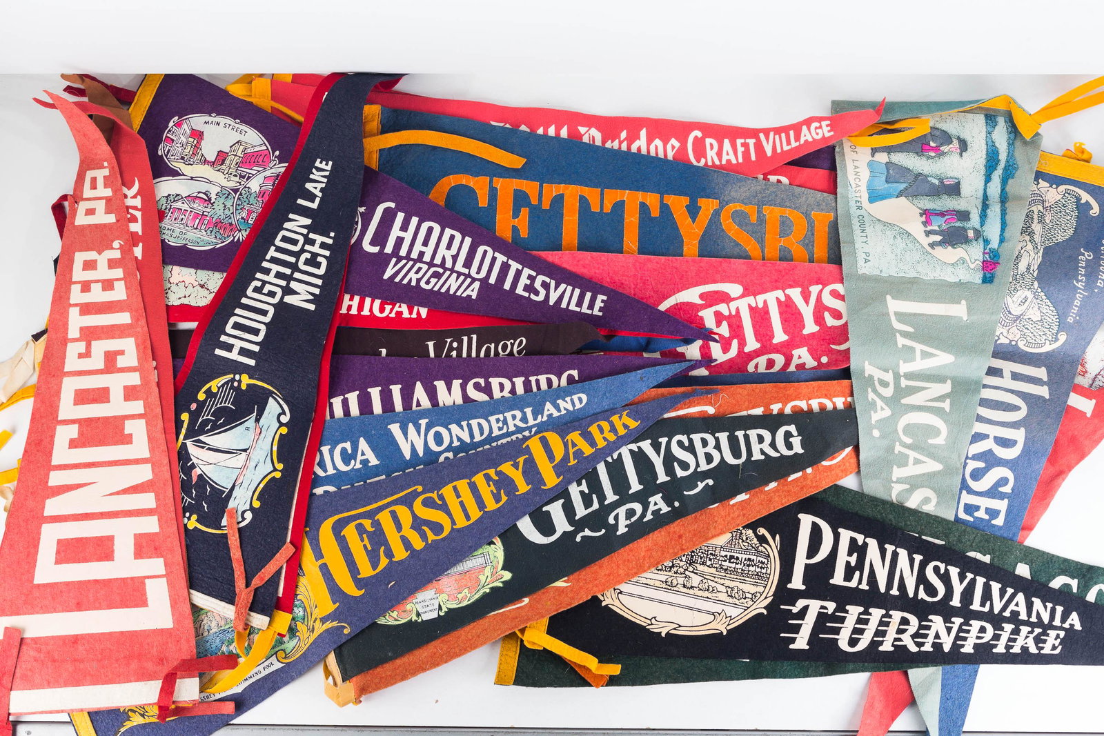Vintage Travel Pennants: Lot includes many Gettysburg and Lancaster, PA pennants, Horseshoe Curve, Altoona PA, Charlotte VA, and many others. All measure approximately 24"L.