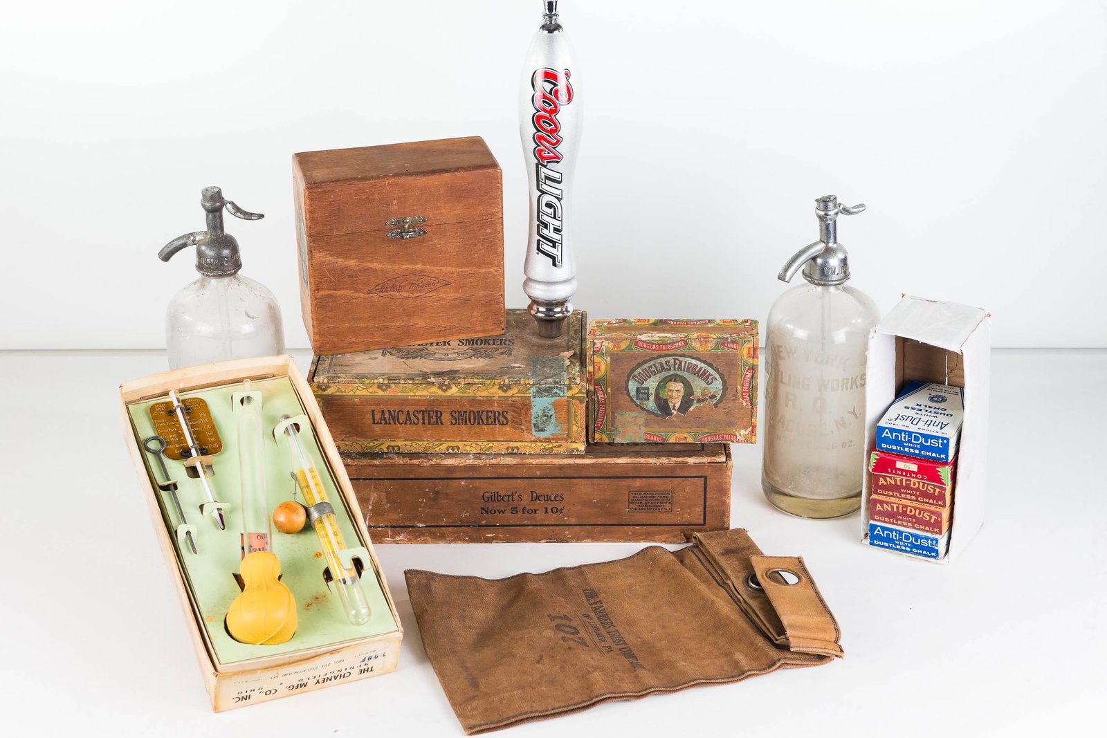 Seltzer Bottles, Cigar Boxes, and Advertising: Lot includes NY and Carneys seltzer bottle (one with wear at cap), a Gilbert's 5 for 10c cigar box, Douglas Fairbanks cigar box, Lancaster Smokers, and Right Tobacco cigar boxes. Lot also includes can