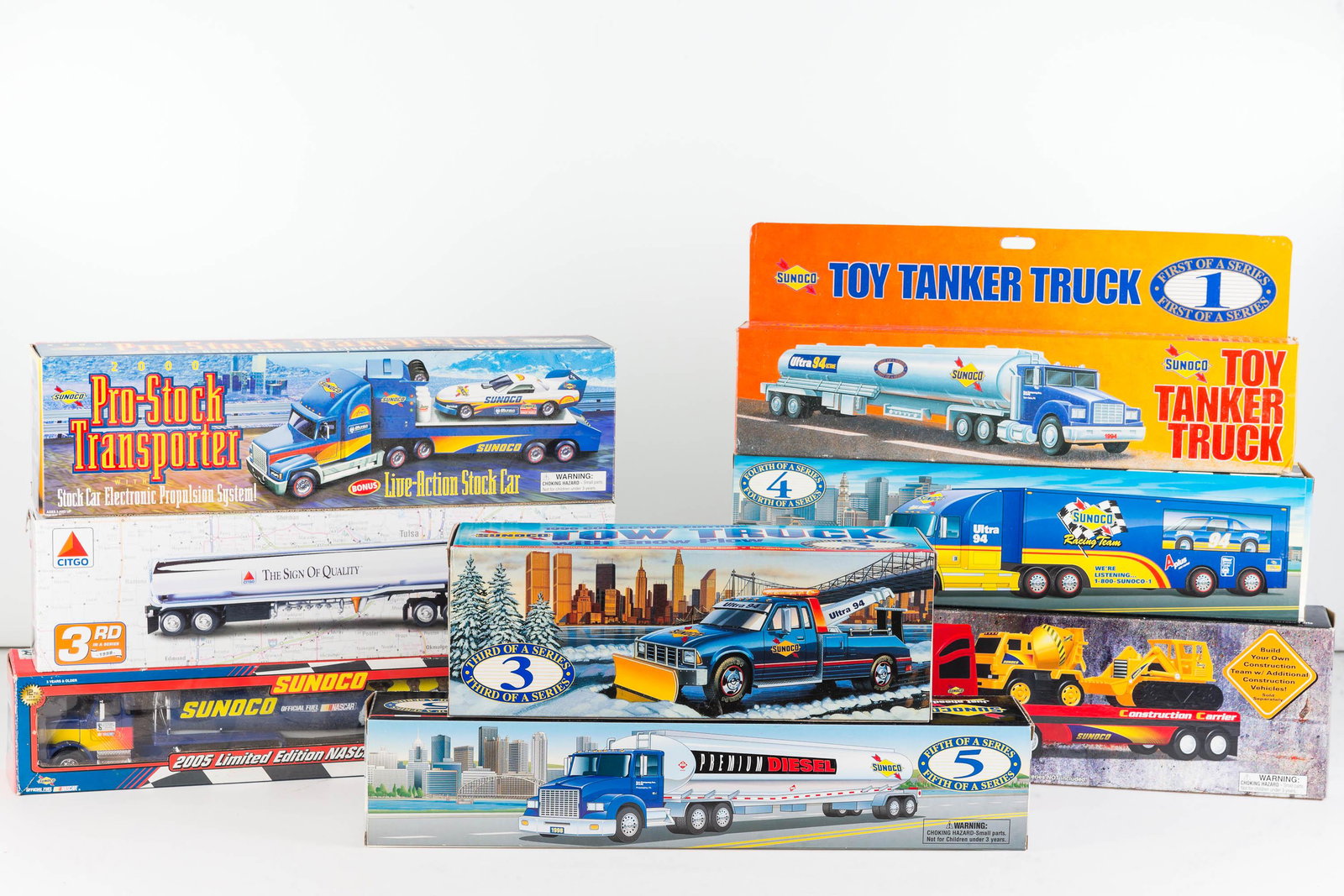 Sunoco Advertising Big Rig Toy Vehicles (8 NIB): Lot includes 8 big rigs, most are Sunoco including Pro Stock Transporter, Fueling Rig, Tow Truck; items part of a series of toy vehicles.