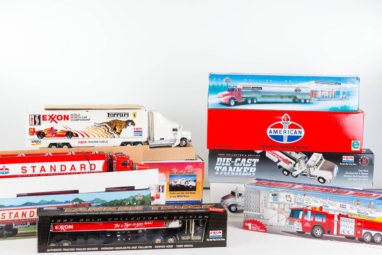 Tanker and Big Rig Toy Vehicles: Lot includes 8 vehicles / die cast, most with gasoline company (Exxon, Standard) advertising and a toy fire truck.