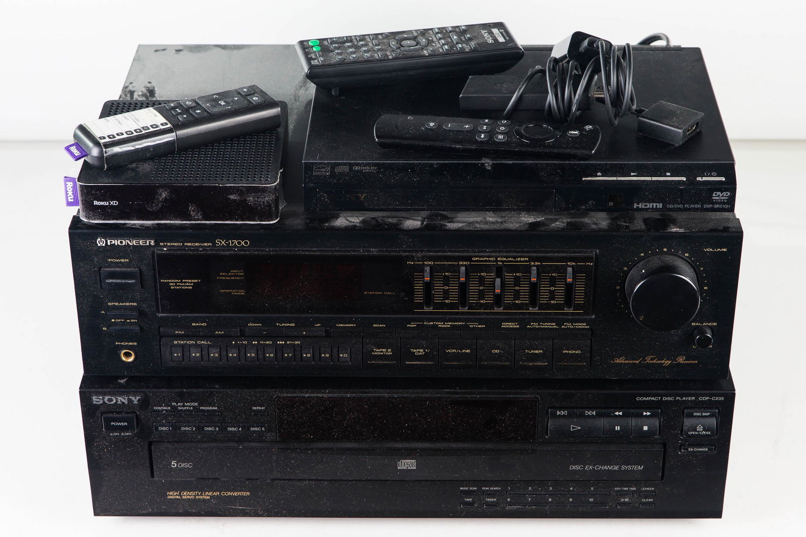 Pioneer and Sony Stereo Equipment: Lot includes a Pioneer SX-1700 receiver with equalizer, and a Sony C235 5 disc CD player. Lot includes remote and accessories.