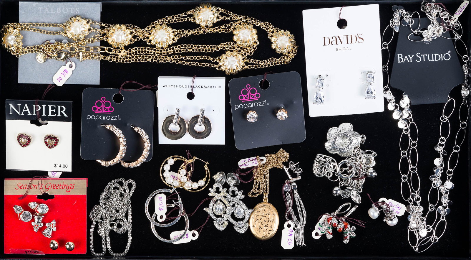 Mixed Designer Jewelry: Lot includes Napier, David's, and other earrings, a pair of sterling dangling earrings, a gold tone Talbot necklace with mother of pearl, a locket on chain, and other items.