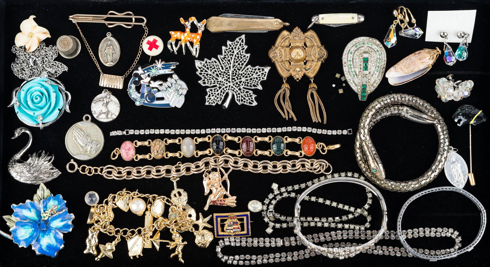 Vintage Estate Jewelry: Lot includes three bracelets including serpent form, rhinestone necklaces and brooches, charm bracelets, brooches, and more.