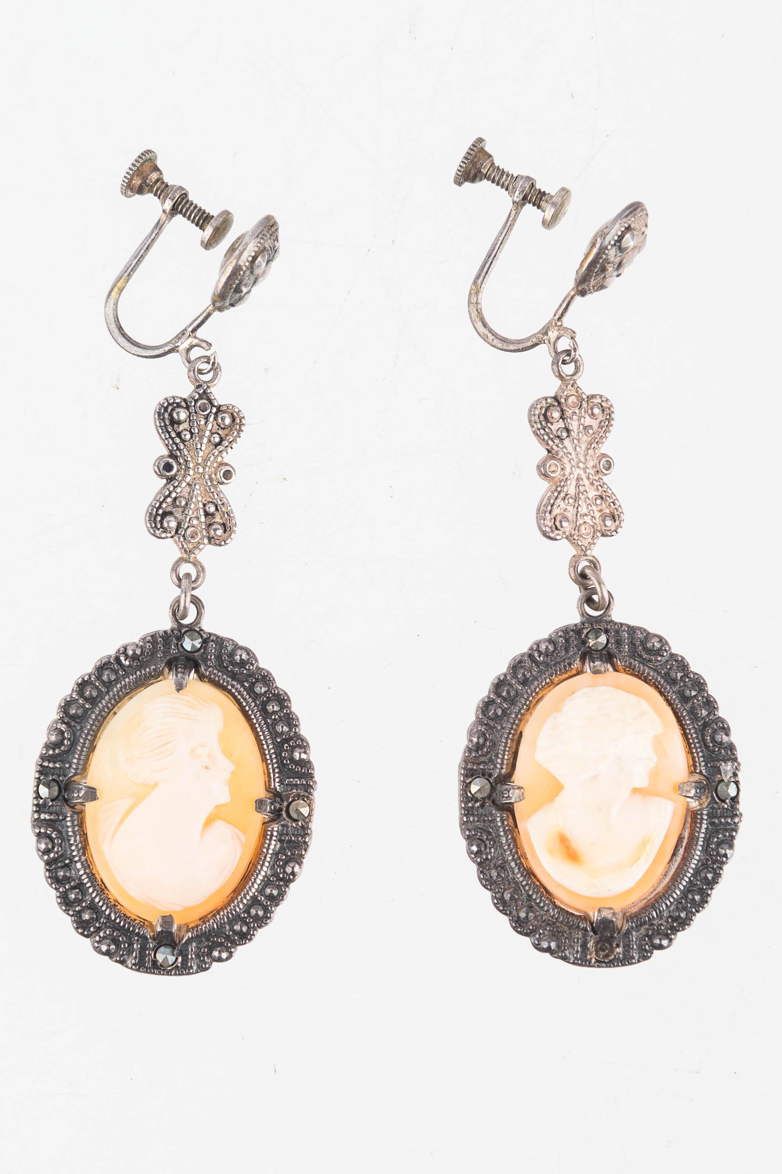 Sterling Cameo Earrings: Long sterling silver with marcasite drop cameo earrings.