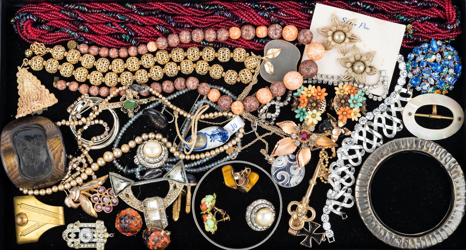 Estate Costume Jewelry: Lot includes glass bead, gold tone necklaces, rhinestone and other brooches, bracelets, earrings, and more.
