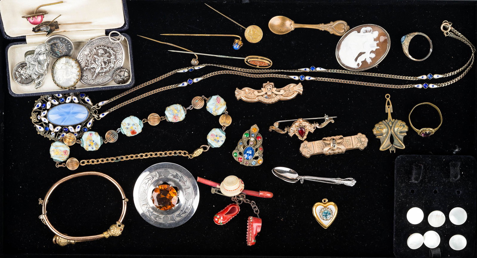 Estate Victorian Jewelry: Large antique jewelry collection to include long blue stone enamel necklace, double lions head bracelet with garnet eyes, three bar pins (one garnet), Scottish brooch with large orange cairngorm stone