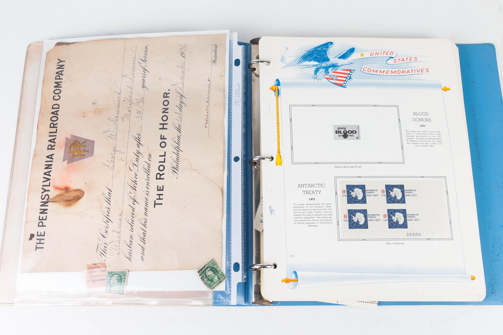 US Commemorative Stamp Album and PRR Cert.: Stamp album begins with 1971 Antarctic Treasury, and it includes '71 Wildlife, US in Space, Care, Christmas, '72 Olympics and other stamps, '73 4-piece stamp sheets. Book is approximately 3/4 full. Lo