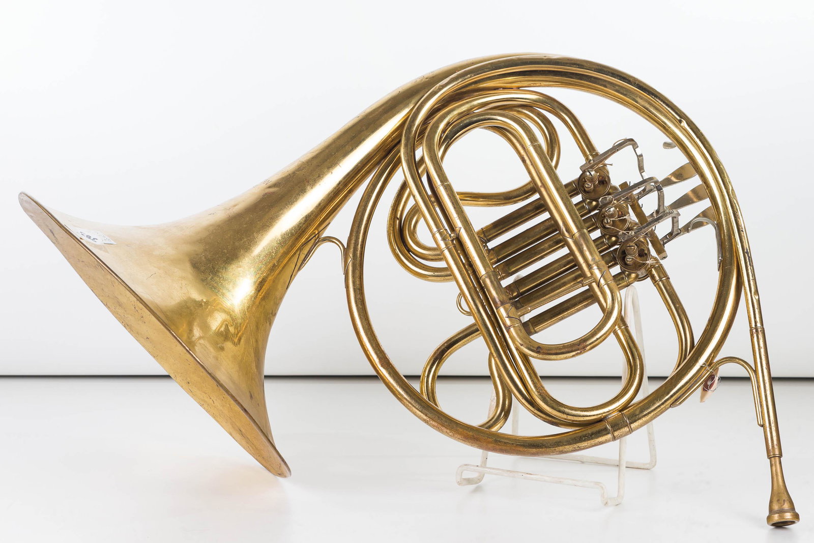 Pan American French Horn: Horn is marked Pan American, Elkhart, IN, USA. One valve is slightly sticky, common dents and wear to surface.