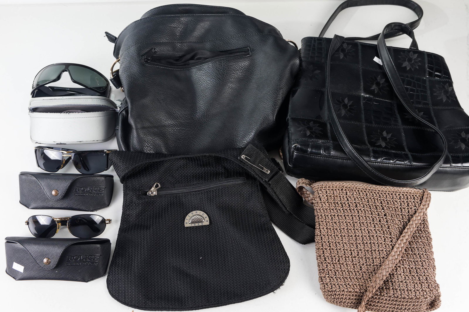 Designer Style Purses and Sunglasses: Lot includes black patent leather style purse marked Tandem, woven cloth purse in tan marked The Sack, black cloth purse marked Terrida 1999, a large black purse with gold beading on side and strap, f