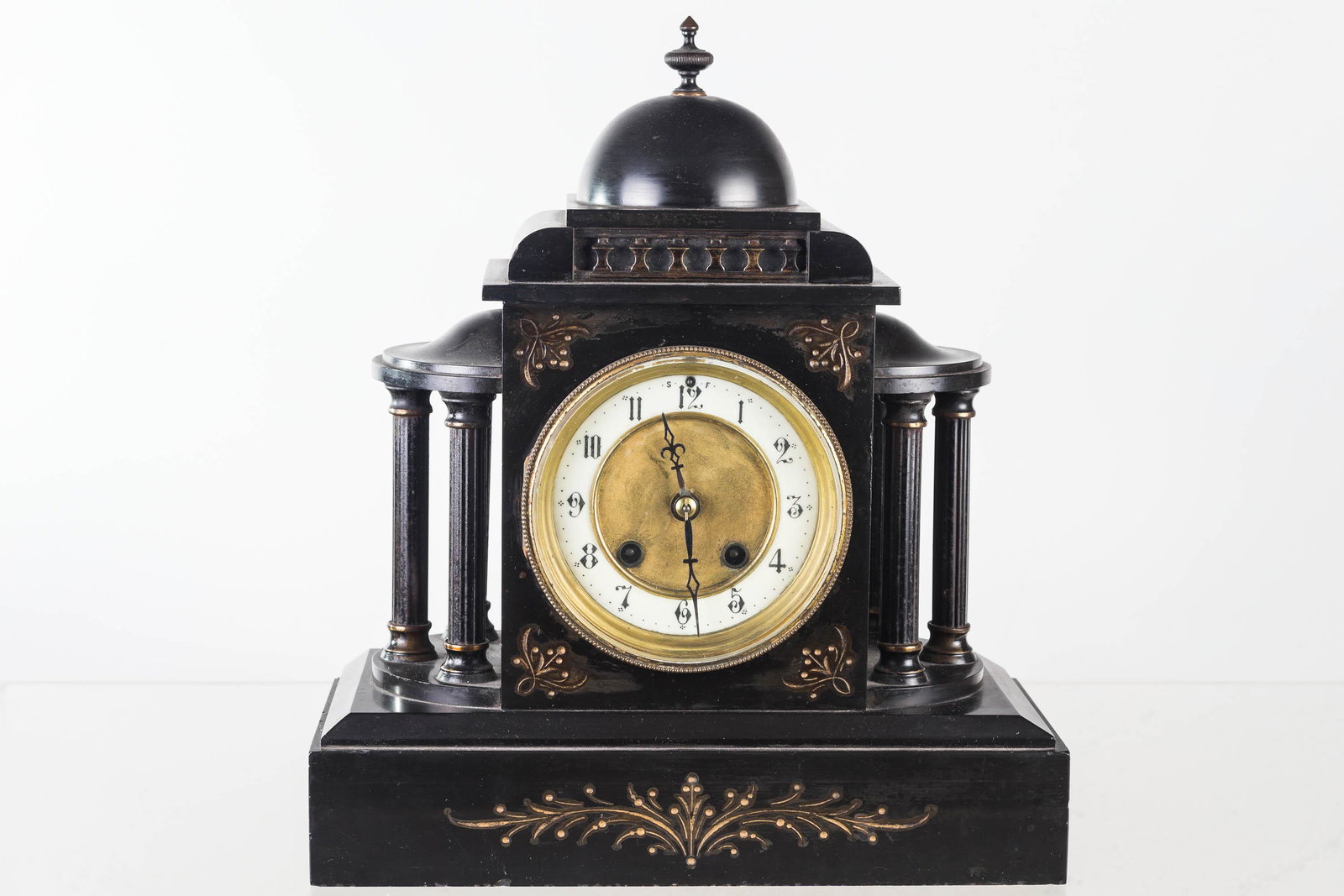 Cast Iron Mantel Clock with Porcelain Face, 19th C: Item measures approximately 13"H. Cast iron construction with three metal pillars on each side. Clock has porcelain surround face and original pendulum, but key is missing. Item is marked Rex on back 