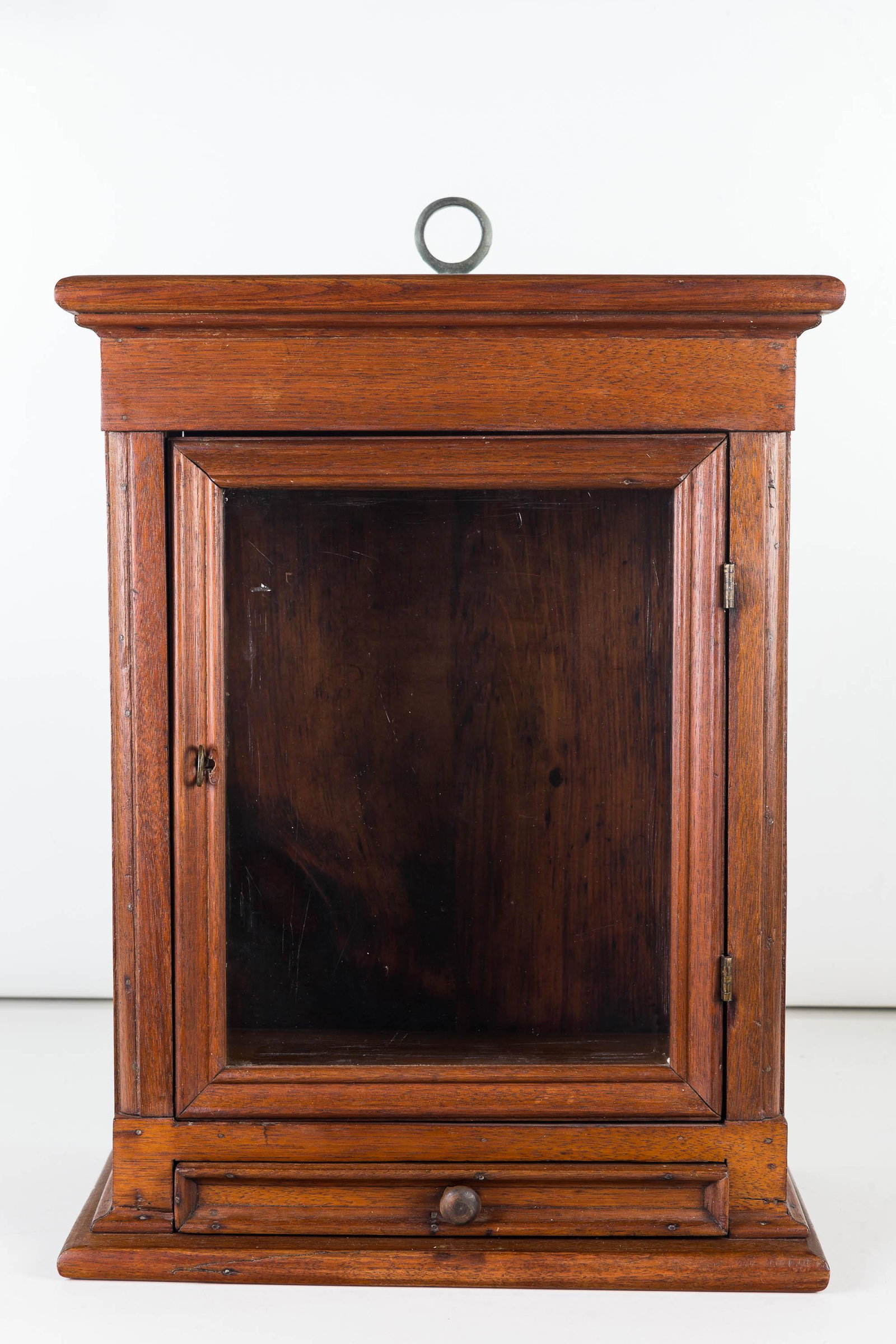 Hanging Cabinet with Drawer, 19th C: Item measures approximately 17.5"H x 13.5"W x 8.5"D. Hardwood construction with a single door above a very small drawer. Item probably held a compass at one time.