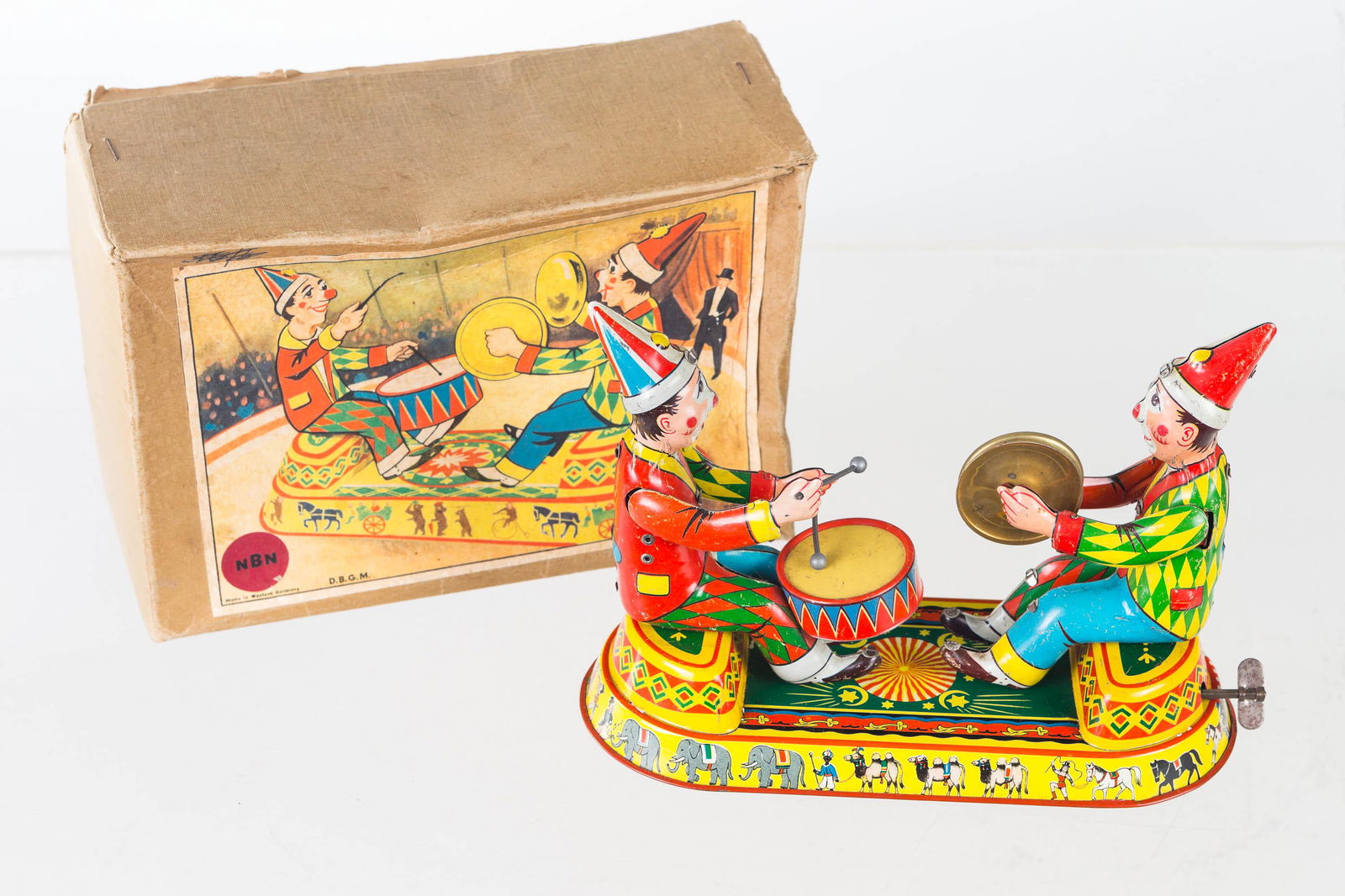 Tin Litho Musical Clown Windup (West Germany): Item measures approximately 6"H x 8.5"L. Key wind toy of two clowns (one with drum, one with symbols). Clean lithography, functioning. It comes in original box (marked NBN, Made in Western Germany. D.