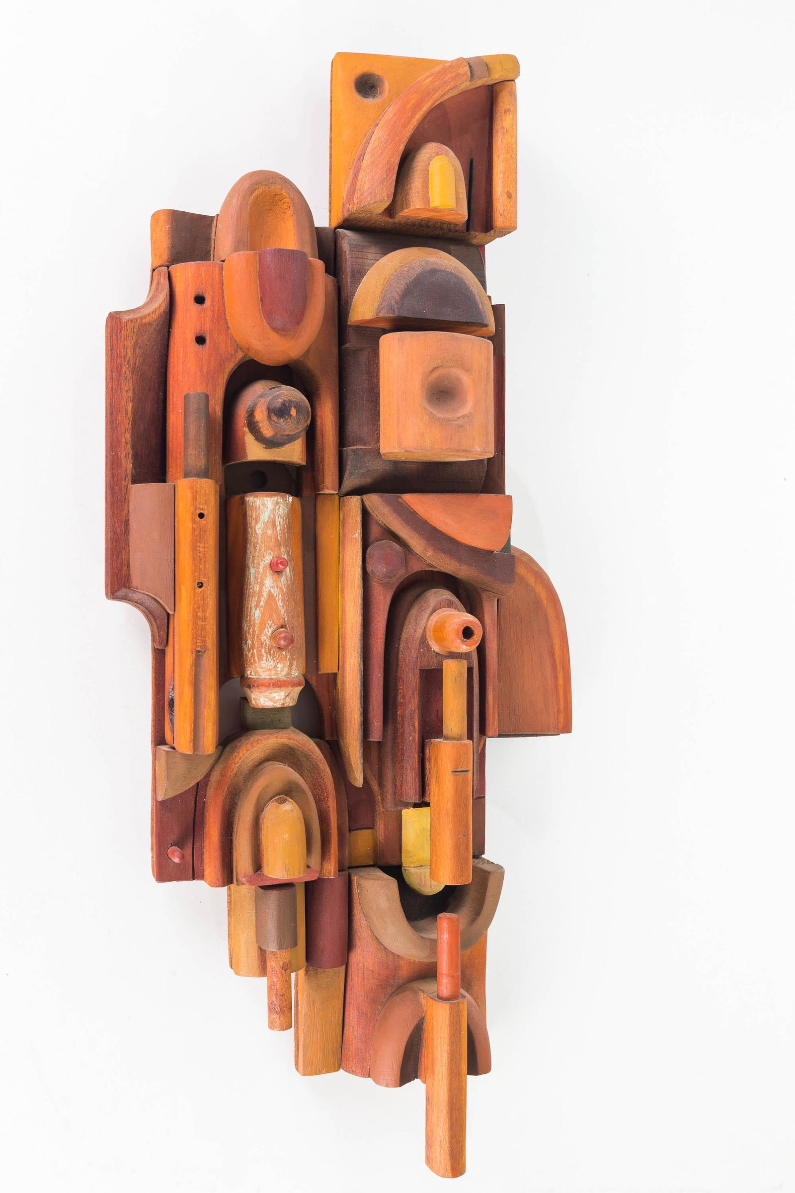 Wooden Post Modern Design Sculpture by Dan Miller: Item measures approximately 24"H x 10"W at widest point. Ornate multi-layer wooden sculpture with some painted, some stained, and some raw wood pieces. Mid-century modern design. Dan Miller etched in