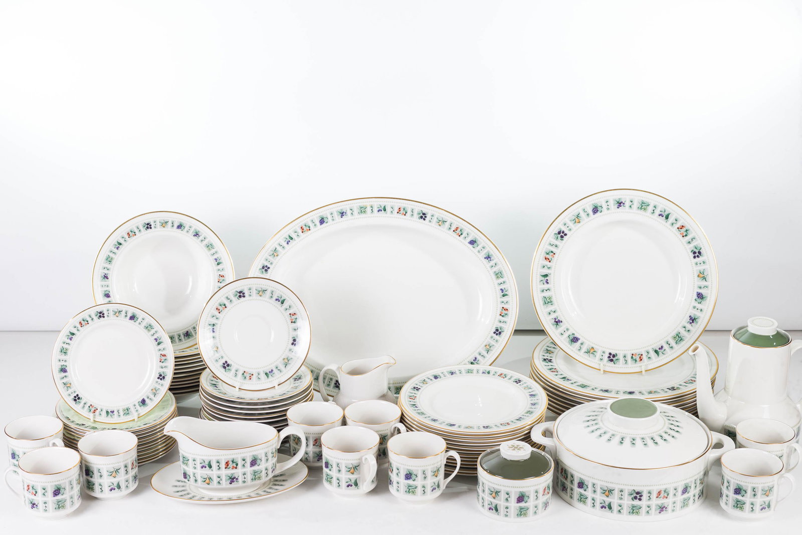 Royal Doulton Tapestry Pattern Dinnerware Service: Lot includes 9 10.5" dinner plates, 12 8" dessert plates, 12 soup bowls, 9 cups and saucers with underplates, a teapot, a covered casserole, a covered jar, and a gravy on stand. China.