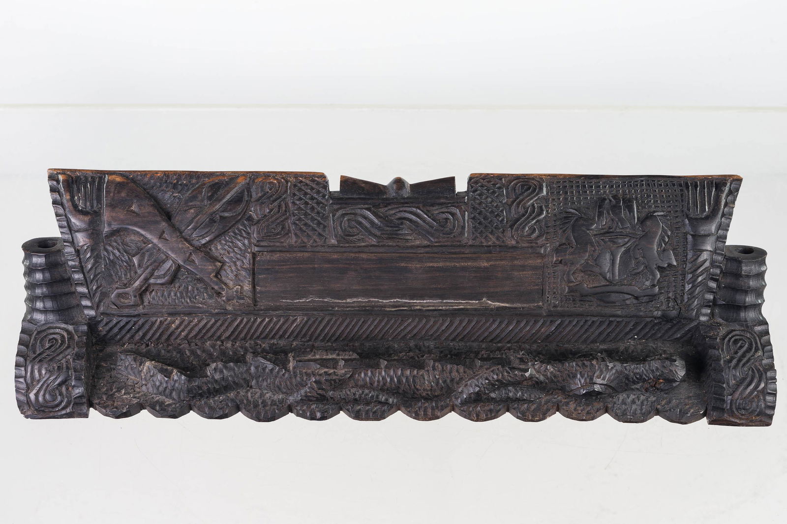 Vintage Folk Art Carved Penholder: Item measures approximately 4"H x 18"W. Carved coat of arms and musical instruments with alligator at front of base. Front has two penholders, back has two vertical and a horizontal penholder. Item ap