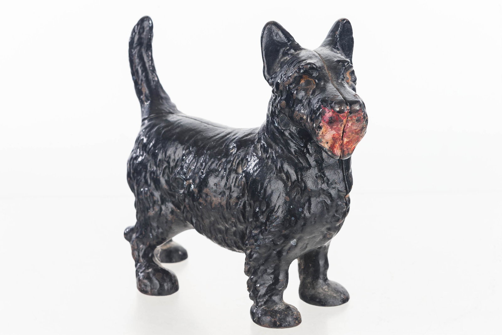 Vintage Cast Iron Scotty Dog Door Stop: Item measures approximately 8.5"H x 10"L. Two piece cast iron door stop with straight head screw. Dates to early 20th C.