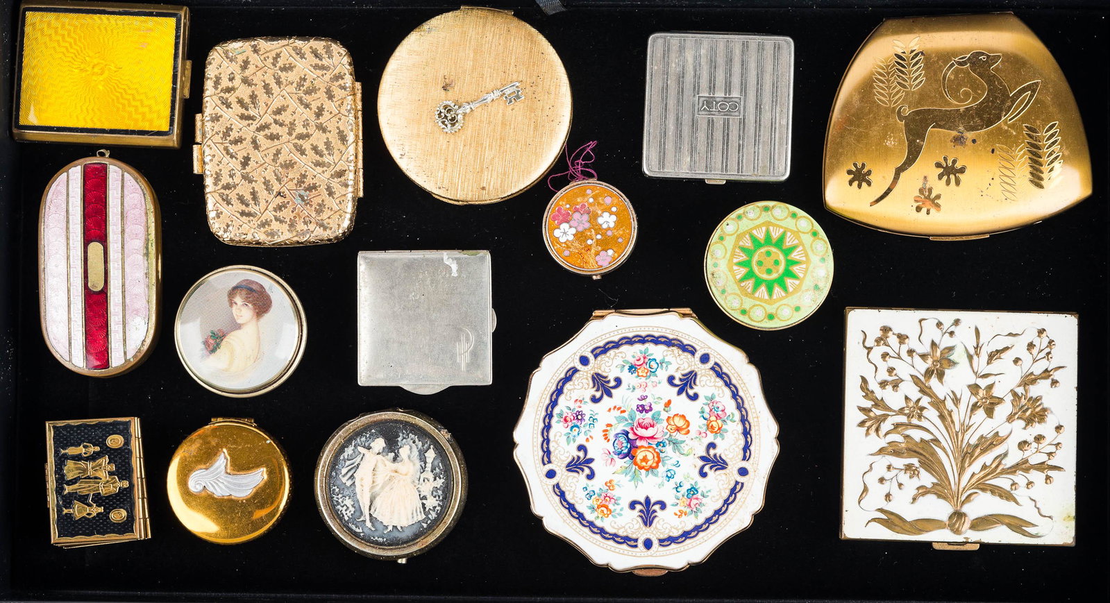 Collection of Vintage Compacts: floral and fleur de lis enameled compact marked Stratton Made in England, compact with gold floral top marked Volupte USA, enameled compact with scuff to pink enameling, yellow top enameled compact, a