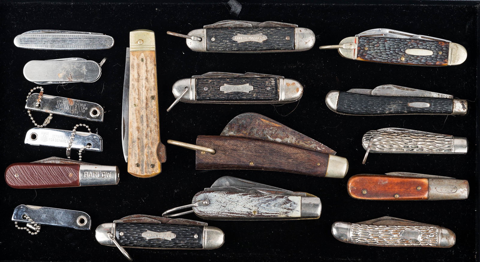 Collection of Folding Knives: a gutting knife with hardwood handle, Camper and Barlow folding knives, two Forest Master folding knives, a York-Dutch Barlow, a Puma 941 marked Made in Germany with stag style handle, and many others