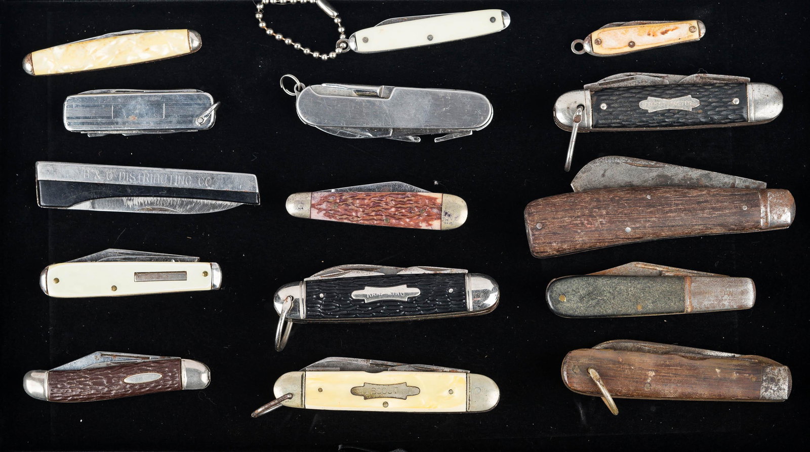 Collection of Folding Knives: knife with mother of pearl style handle, Camp King, Forest Master, B&G Distributing Company advertising knife, and others. 15 total pieces.