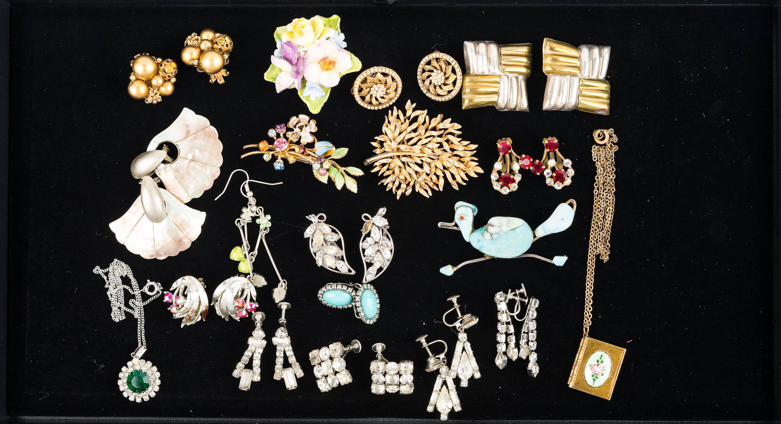 Rhinestone Earrings and Mixed Costume Jewelry: a grouping of screw back and clip earrings, gold tone Lisner tree brooch, Staffordshire floral brooch, locket with hand painted enameled face, necklace with green and clear rhinestone pendant, and oth