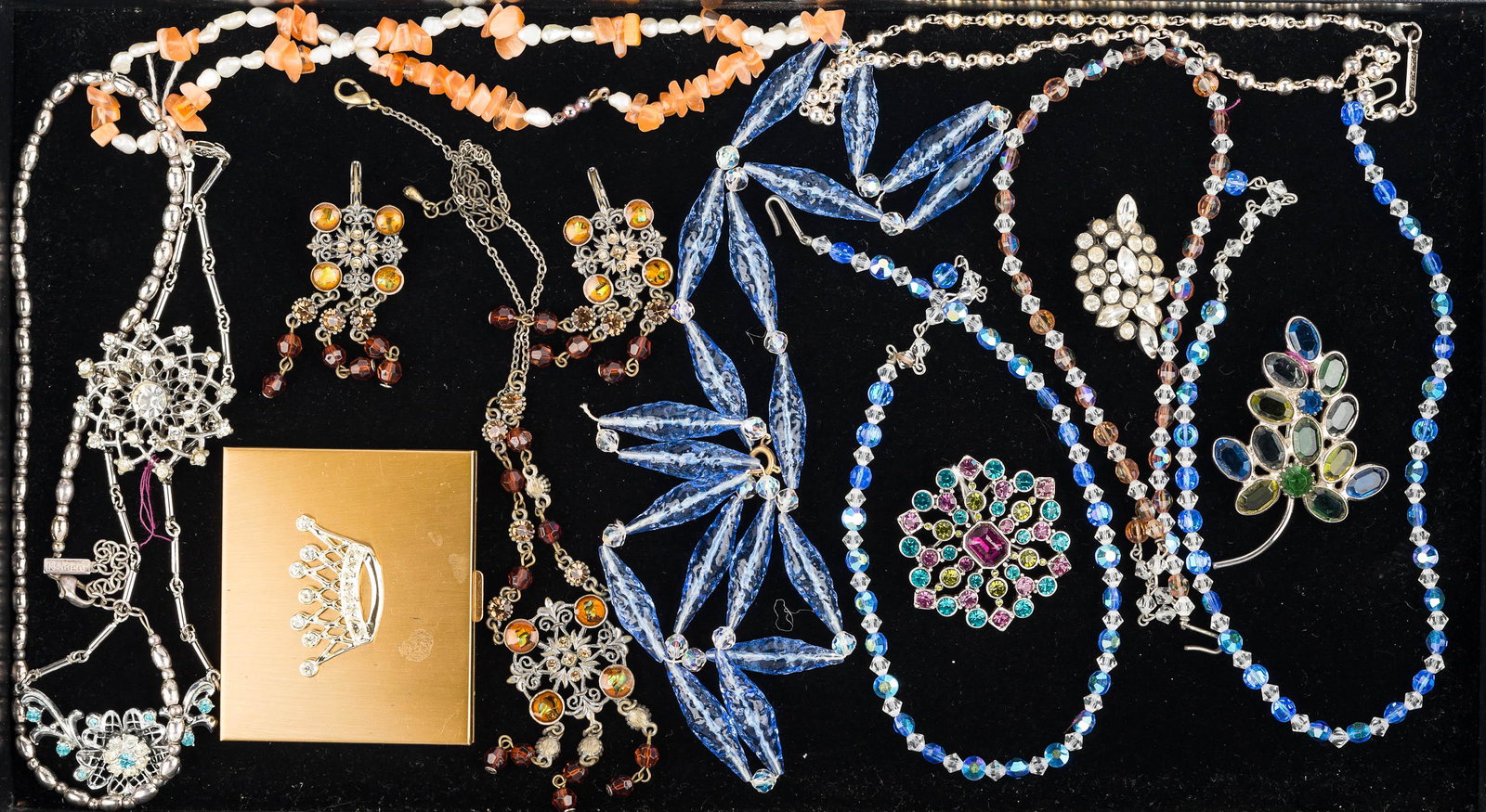Rhinestone Jewelry and Colorful Necklaces: multicolor colorful glass and crystal necklaces, silver tone Napier beaded choker, necklace and dangling earring set with red and amber stones, multicolor rhinestone brooch marked Monet, other rhinest
