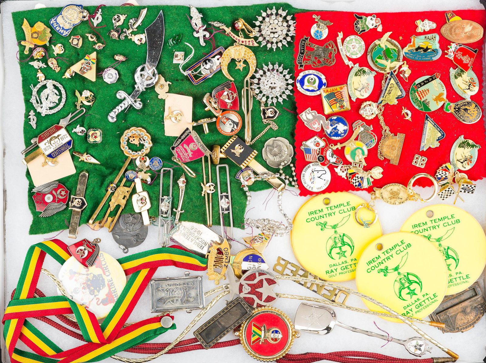 Masonic Lapel Pins, Jewelry, and Related: enameled pendant in ribbon, enameled Lulu fez pin, Shriners Sword pins and brooch, many Masonic tie tacks, Shriners bolo, gold tone Shriner pendant with red rhinestones, and travel lapel pins, tie bar