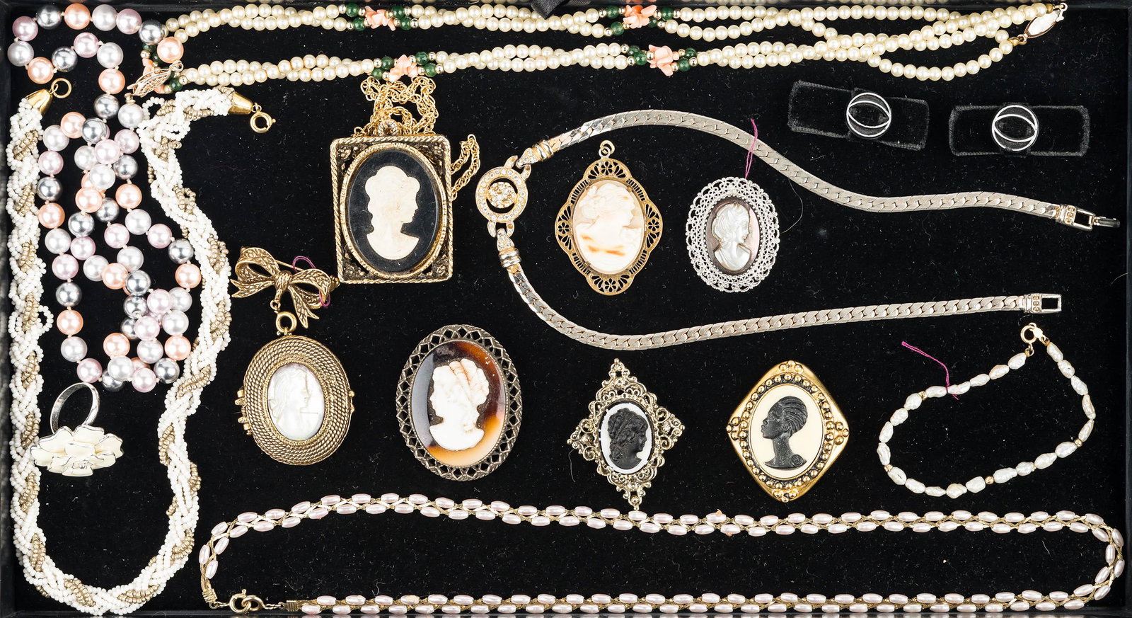 Sterling, Cameos, and Costume Jewelry: mother of pearl cameo with sterling filigree frame, gold filled Victorian cameo with filigree frame, a Coreen Simpson African American cameo with loss to latching mechanism on back, cameo locket and o
