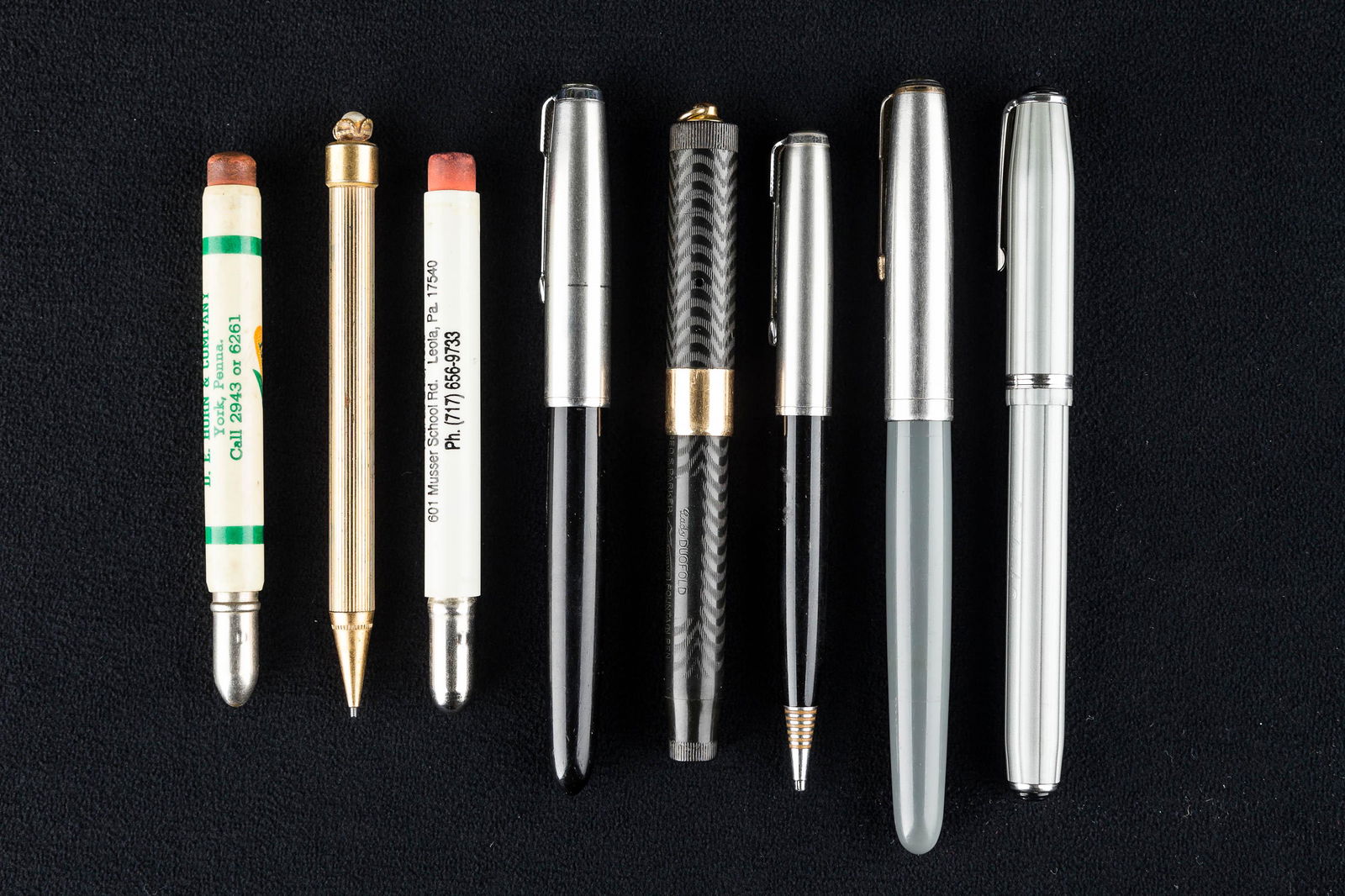 Quality Pens and Pencils: a George S. Parker Lucky Curve fountain pen (last patent date 1925), bullet pencil with Super Crost seed advertising, black and silver tone Parker pencil, and other fountain pens and pencils.