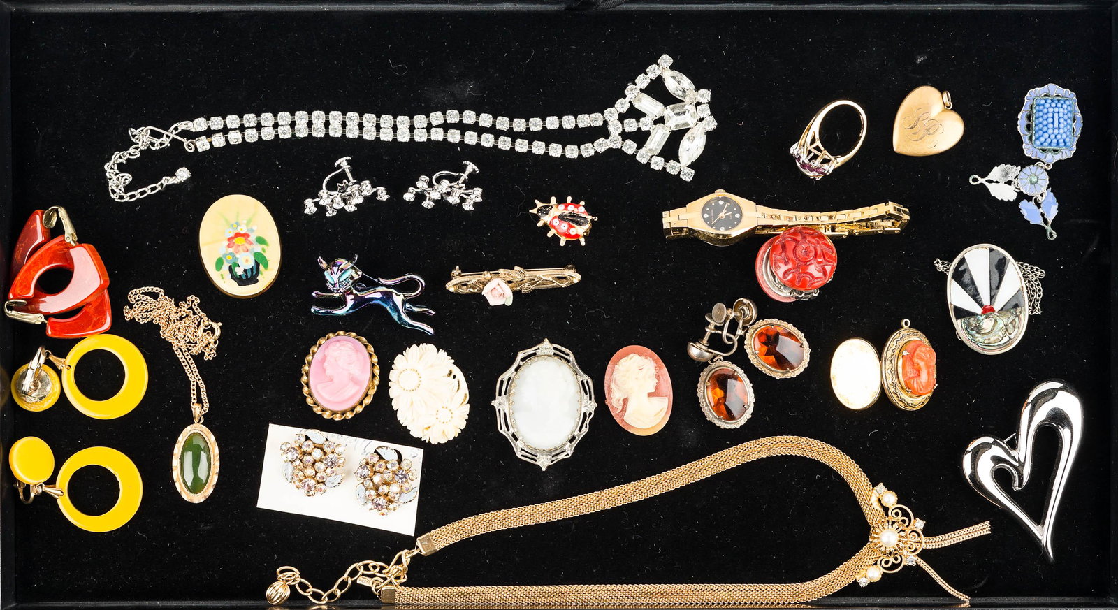 Cameos and Colorful Costume Jewelry: Three cameos with frames (one is a locket), 2 loose cameos (one is a bust, one is floral), a ladies Pierre Cardin quartz wrist watch, a pair of Weiss multicolor clip earrings on card, 2 pairs of Bakel
