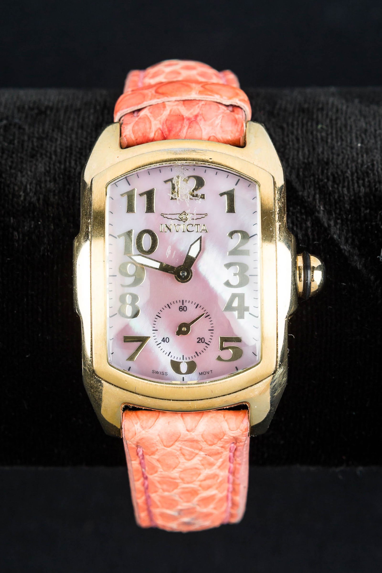 Invicta Watch: Water resistant Swiss made movement, stainless steel case, mother of pearl face on a copperhead snake skin strap. In working order.