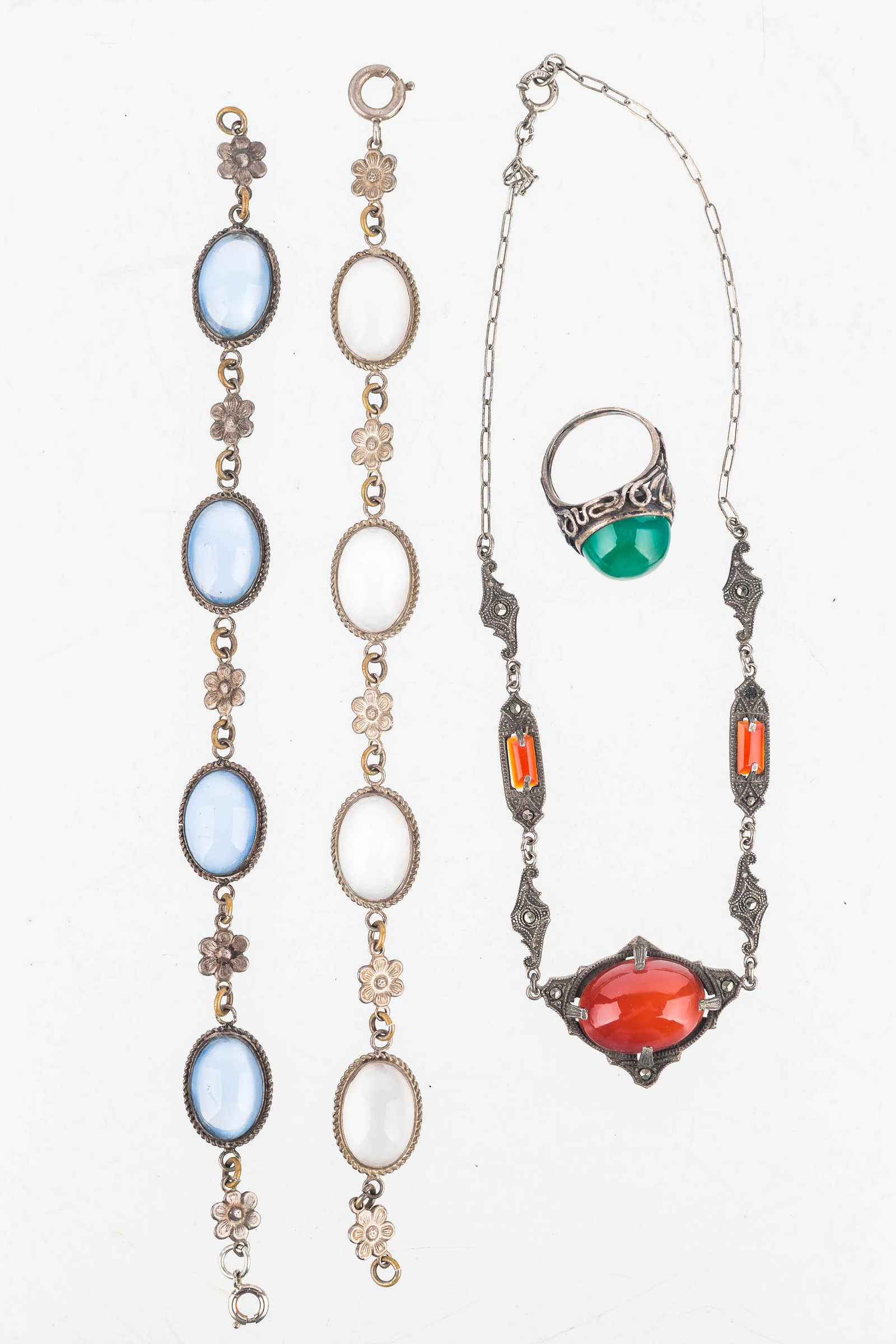 Art Deco Sterling Estate Jewelry: Carnelian marcasite sterling silver necklace, green celadon floral design ring, pair of blue stone and clear stone floral bracelet. The necklace is stamped sterling as well as the white and blue stone