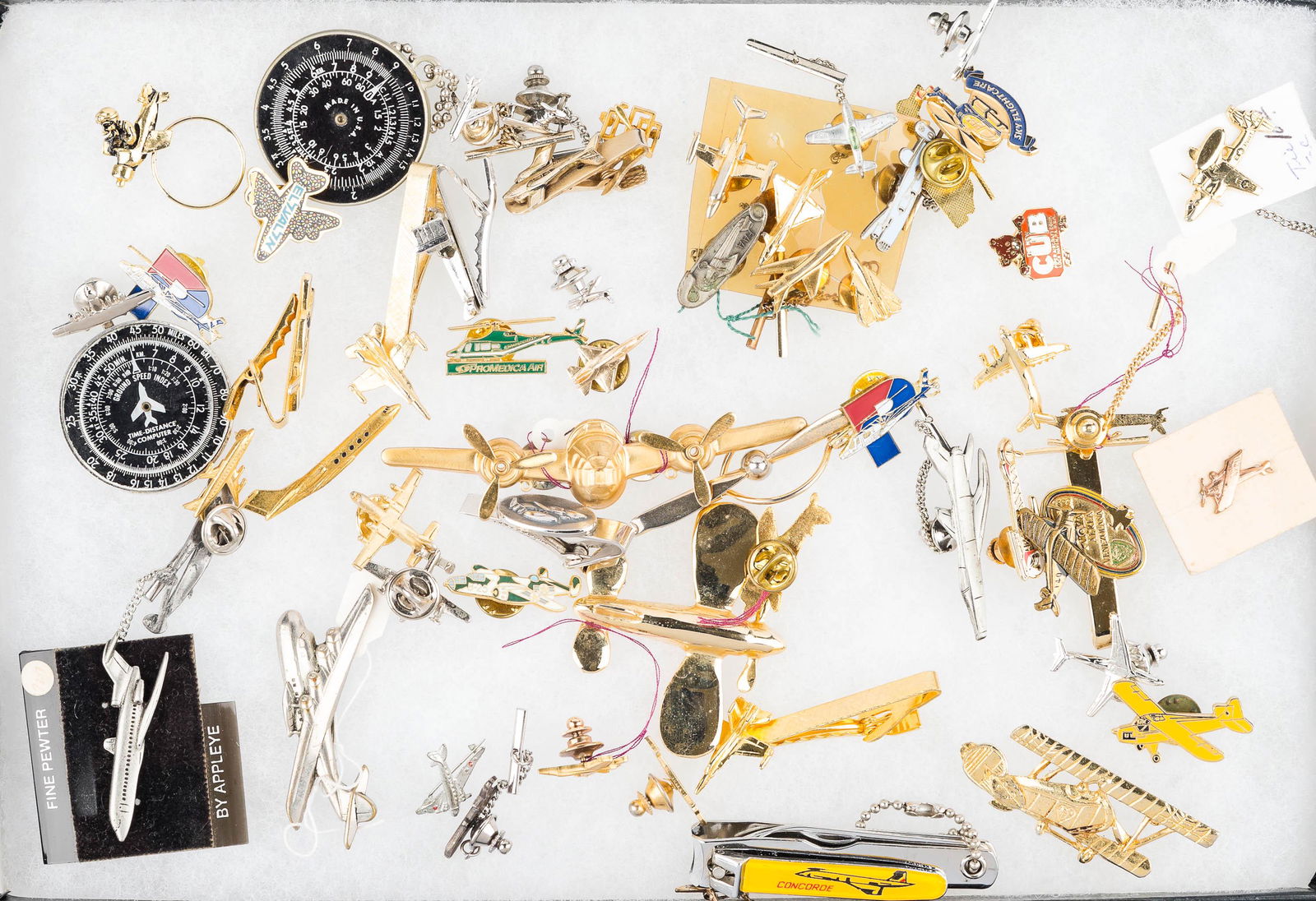 Aeronautic Costume Jewelry: airplane and jet lapel pins, tie tacks, jacket pins, compass keychains, and related items.