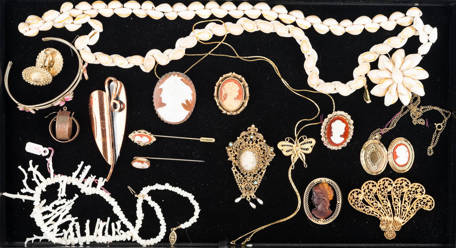Cameos and Other Costume Jewelry: cameo locket, cameo stick pins, and cameo brooches, large gold tone fan brooch, copper Renoir leaf brooch, and other costume jewelry.