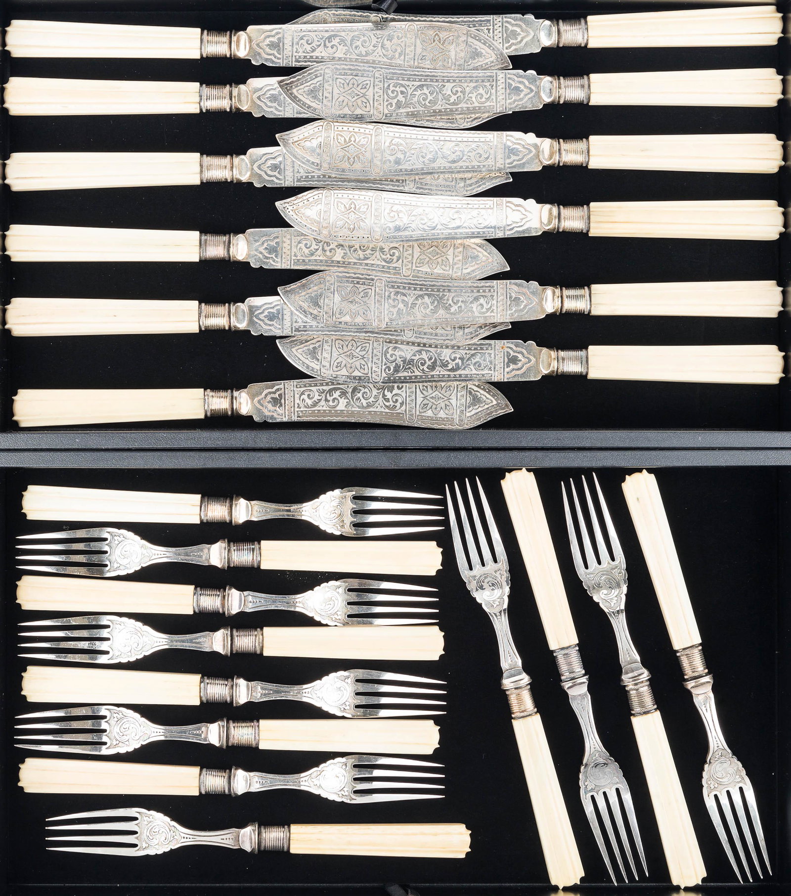 Victorian Handled Fish Set: 12 forks and 12 knives. Each fork measures approximately 7.75"L. They are ornate silver plate with bone handles, and show an English marking.