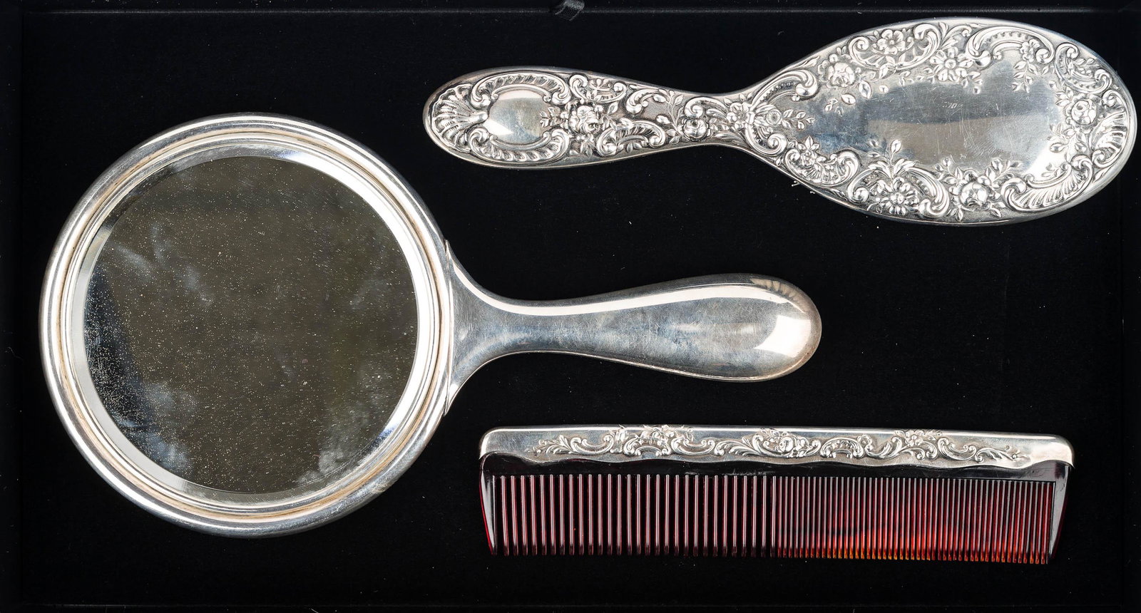 Victorian Gorham Sterling Dresser Set: hand mirror (10"L) with matching brush with good bristles, and comb. All pieces are marked Gorham Sterling and all are in good condition, including mirror glass.