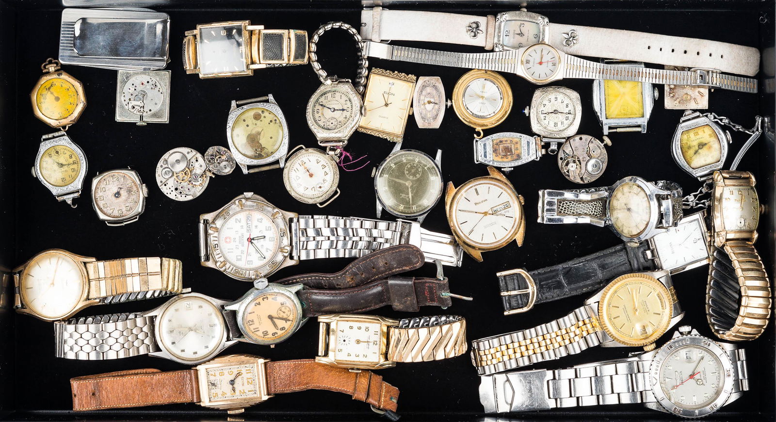 Large Collection of Watches: various Bulova, a Swiss Military with water damage, Elgins, ladies Armitron Quartz with scratched face, many vintage ladies watches, many missing bezel, and various movements. Various conditions, unte