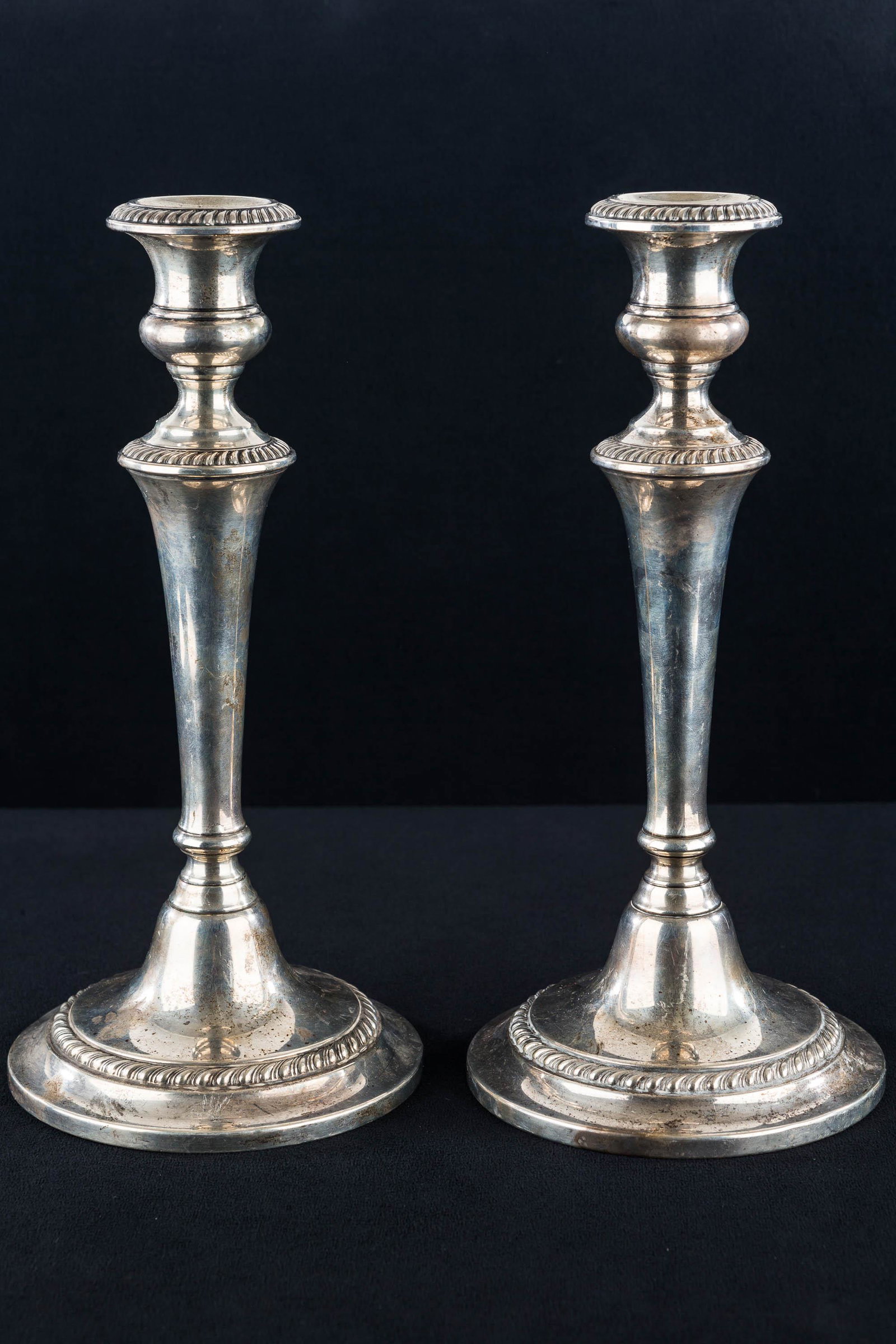Tall Gorham Sterling Weighted Candlesticks: Each in the pair is approximately 10.25"H. Marked Gorham Sterling Model No. 670. One has a small dent at base.