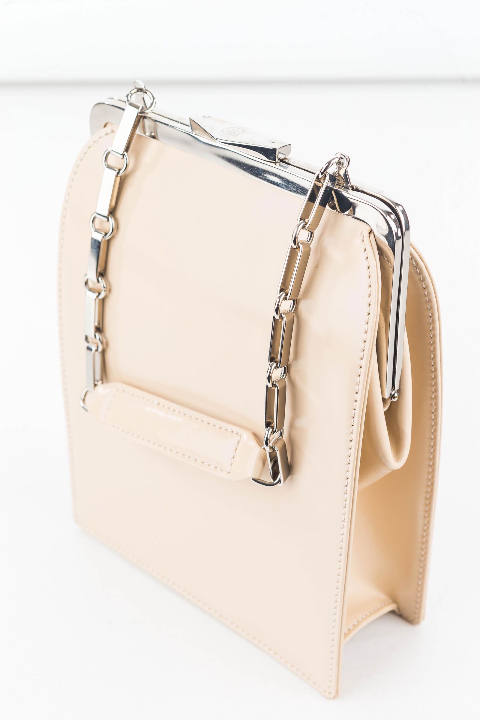 Mark Cross Beige Leather Shoulder Bags: Standing slim purse approx 6" x 8" x 2" with a silver tone chain and leather hand strap, metal hardware and snap closure. Inside is one expanding pocket and includes a leather cleaning cloth. Marked M
