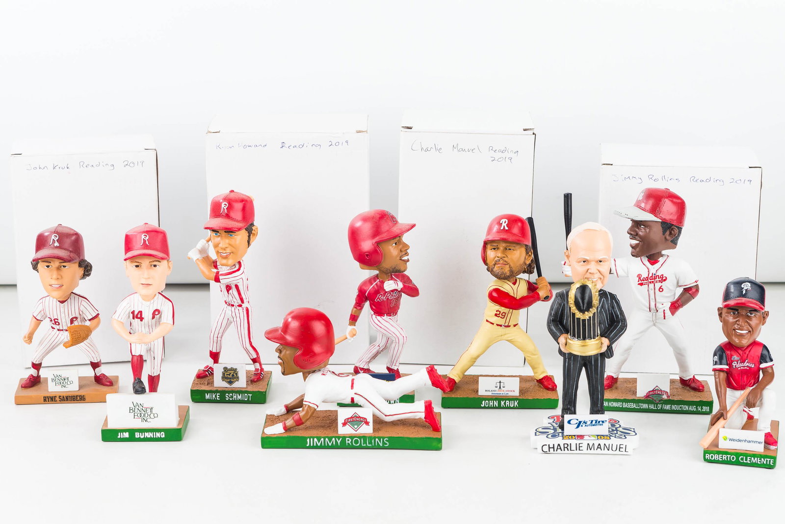 Reading Pirates & 8 Phillies (AAA) Bobbleheads: a Reading Pirates Roberto Clemente game handout promo bobble head and 8 Reading Phillies (Phillies AAA Team) game handout promo bobble heads. (Charlie Manuel, John Kruk, Mike Schmidt, Ryan Howard, Dom