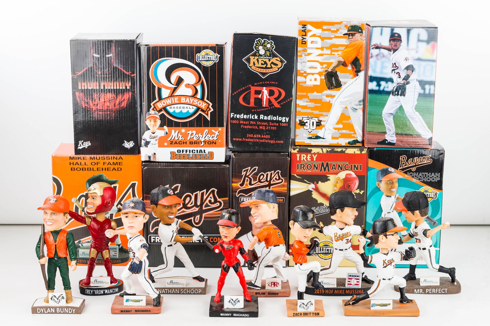Frederick Keys and Bowie Baysox Bobbleheads: 6 Frederick Keys (Orioles A Team) (2 Manny Machado, 2 Dylan Bundy, Kevin Gausman, and Zack Britton) and 4 Bowie Baysox (Orioles AA Team) (Zach Britton, Jonathan Schoop, Trey Mancini, and Mike Mussina)