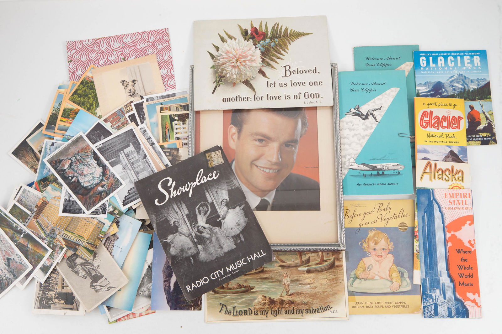 Postcards and Other Ephemera: Lot includes a large selection of early to mid 20th C postcards (a few are military related), two unframed religious prints, a few travel maps, a photo print of Robert Wagner and related items.