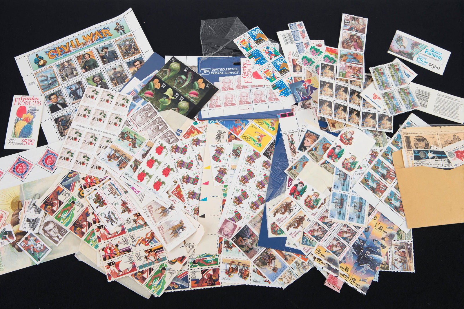 Collection of Part Stamp Sheets: Lot includes complete Civil War 22c, Snoopy 34c (complete but open), other part sheets include Military 33c, Botanical 34c, Henry Luce 32c, and many others. Over 200 stamps, none are canceled, some ar