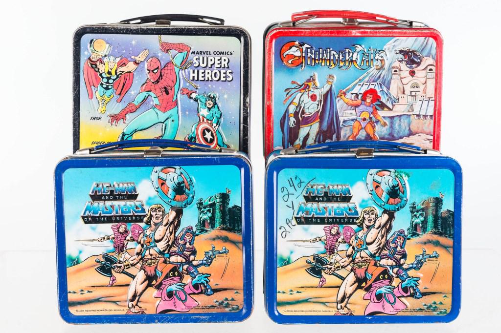 Marvel Superheroes and Other Lunch Boxes: Lot includes 1976 Marvel Superhero lunch box, 1985 Thundercats lunch box, and 2 1984 He-Man lunch boxes (one with thermos). Lunch boxes show common wear