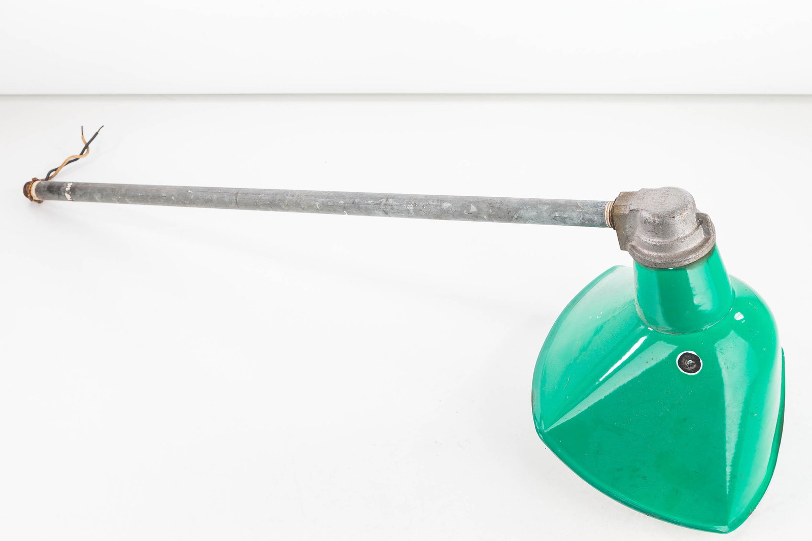 Vintage Green Metal Industrial Hanging Lamp: Rectangular shade measures 10"L x 9"W. It is green enameled metal with white interior. Item is on a galvanized pull that appears to be original to piece. One ding to surface.