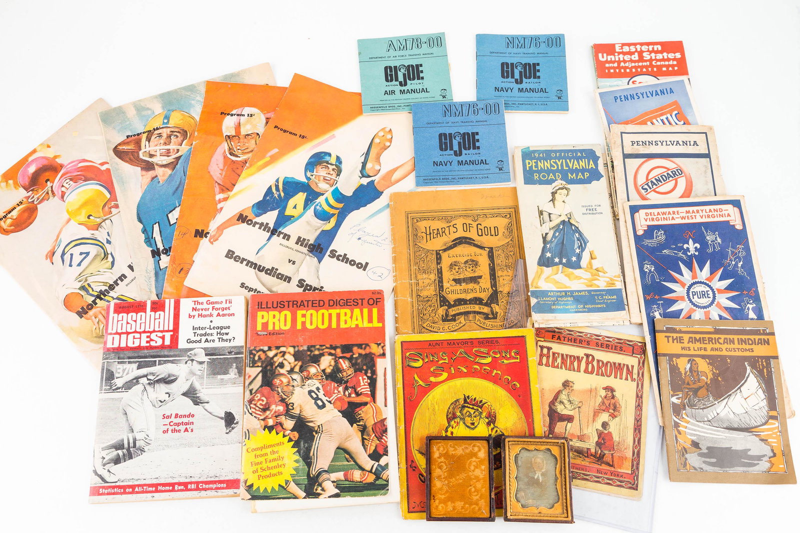 Mixed Ephemera Grouping, Sports, Maps: Four 1963 Northern High School Dillsburg PA football programs (2 with writing on covers), five vintage road maps, 1970s baseball and football digest, three 1964 GI Joe manuals, a daguerreotype of a la